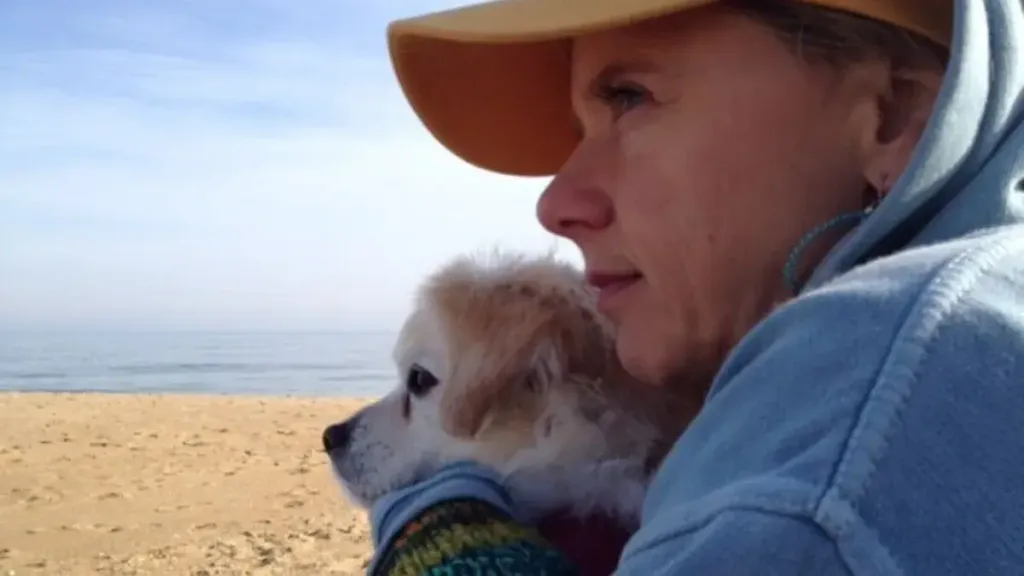 Laura Lynn and her dog PJ at the beach