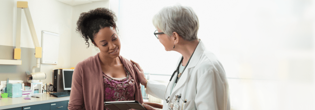 Doctor going over breast cancer genomic test results